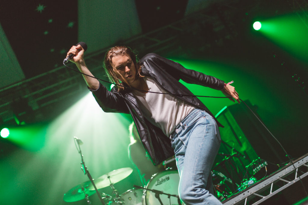 Alex Cameron performing on tour